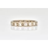 A WHITE GOLD AND DIAMOND FULL ETERNITY RING
