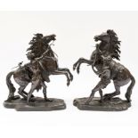 AFTER GUILLAUME COUSTOU THE ELDER (1677-1746); A PAIR OF BRONZE MODELS OF THE MARLY HORSES (2)