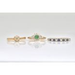 A 9CT GOLD, EMERALD AND DIAMOND CLUSTER RING AND TWO FURTHER RINGS (3)