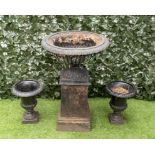 A LATE 19TH CENTURY BLACK PAINTED CAST IRON JARDINIERE ON STEPPED SQUARE STAND (3)