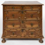 A CHARLES II GEOMETRIC MOULDED OAK TWO PART CHEST