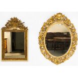 A 19TH CENTURY FLORAL CHASED GILT FRAMED OVAL MIRROR (2)