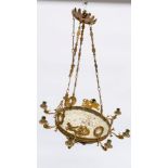 AN EMPIRE REVIVAL GILT AND PATINATED BRONZE EIGHT-LIGHT CHANDELIER