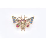 A DIAMOND, RUBY, SAPPHIRE AND HALF PEARL SET BUTTERFLY BROOCH
