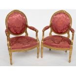 A PAIR OF 18TH CENTURY FRENCH GILT OPEN ARMCHAIRS (2)