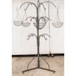 A LARGE WROUGHT IRON HANGING BASKET/ PLANT STAND