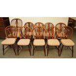 A MATCHED SET OF TEN BEECH AND ELM WHEEL BACK WINDSOR CHAIRS TO INCLUDE A PAIR OF YEW BACKED...