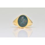 AN 18CT GOLD AND BLOODSTONE OVAL SIGNET RING