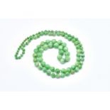 A SINGLE ROW NECKLACE OF JADE BEADS