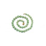 A SINGLE ROW NECKLACE OF JADE BEADS