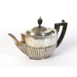A LATE VICTORIAN SILVER TEAPOT