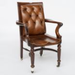 A 19TH CENTURY MAHOGANY AND LEATHER UPHOLSTERED DESK CHAIR