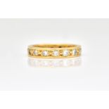A YELLOW GOLD AND DIAMOND FULL ETERNITY RING,