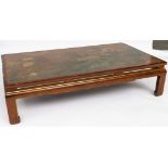 A LARGE CHINESE HARDWOOD RECTANGULAR COFFEE TABLE WITH INSET POLYCHROME PAINTED PANEL