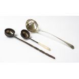 A GEORGE III SILVER SOUP LADLE AND TWO FURTHER LADLES (3)