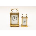 A FRENCH BRASS CASED CARRIAGE CLOCK AND ANOTHER SMALLER CARRIAGE CLOCK (2)