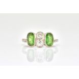 A PLATINUM, DIAMOND AND GREEN GEMSTONE SET RING