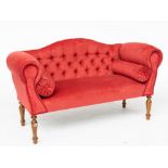 A SMALL REGENCY STYLE HUMP BACK SOFA