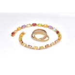 A GOLD AND GEMSTONE SET BRACELET AND A RING (2)