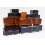 A GROUP OF GILT-TOOLED LEATHER JEWELLERY AND WATCH BOXES (11)