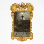 A GEORGE III GILT FRAMED MIRROR WITH HO HO BIRD CREST