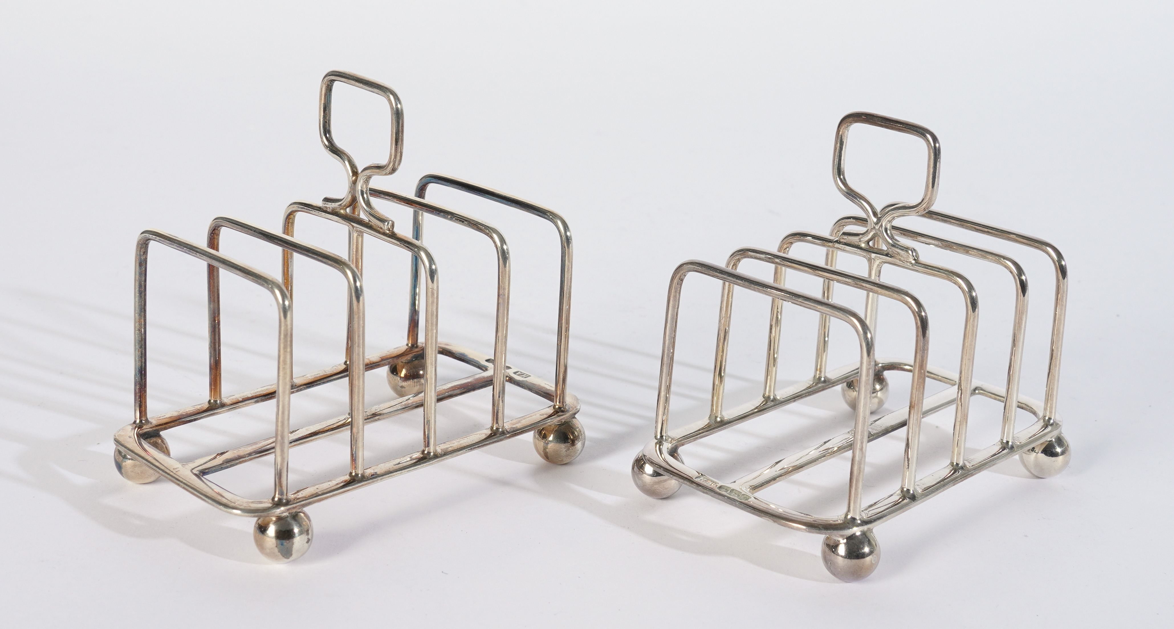 A PAIR OF SILVER FIVE BAR TOASTRACKS (2) - Image 2 of 2