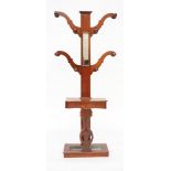 A VICTORIAN MAHOGANY MIRRORED BACK TREE HALL STAND