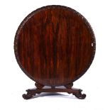 A REGENCY ROSEWOOD CIRCULAR SNAP-TOP CENTRE TABLE