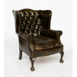 A MID-18TH CENTURY STYLE STUDDED GREEN LEATHER UPHOLSTERED WINGBACK ARMCHAIR