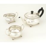 A SILVER THREE PIECE TEA SET