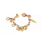 A 9CT GOLD CHARM BRACELET