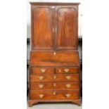 A MID-18TH CENTURY MAHOGANY BUREAU CABINET