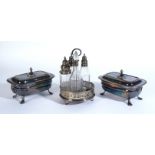 A GEORGE III SILVER CRUET STAND AND A PAIR OF PLATED ON COPPER TUREENS AND COVERS (3)