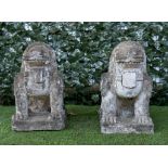 A PAIR OF EASTERN CARVED GRANITE FIGURES OF SEATED DOGS OF FO (2)