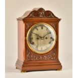 AN EDWARDIAN MAHOGANY BRACKET CLOCK