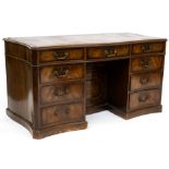 A 19TH CENTURY MAHOGANY SERPENTINE SHAPED PEDESTAL DESK