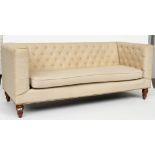 A MODERN CREAM UPHOLSTERED SQUARE BACK SOFA