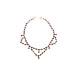 A GOLD AND GARNET NECKLACE