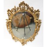 A GEORGE III ROCOCO REVIVAL GILT-WOOD AND GESSO OVAL MIRROR