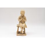 AN ITALIAN CARVED ALABASTER SCULPTURE OF A SEATED GIRL