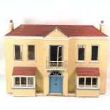 A MID-20TH CENTURY DOLLS HOUSE, TOGETHER WITH A QUANTITY OF FURNITURE