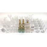 A QUANTITY OF MOSTLY 20TH CENTURY GLASS INCLUDING DECANTERS, DRINKING GLASSES, HURRICANE LAMP...