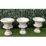 A GROUP OF THREE MODERN WHITE PAINTED RECONSTITUTED STONE GARDEN URNS (3)