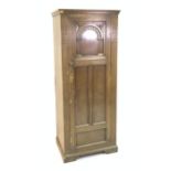 AN EARLY 20TH CENTURY OAK SINGLE WARDROBE