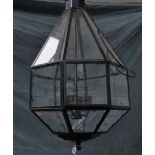 A BLACK METAL HEXAGONAL TAPERING HANGING LANTERN