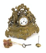 A LATE 19TH CENTURY GILT METAL MANTEL CLOCK MOULDED WITH FIGURES