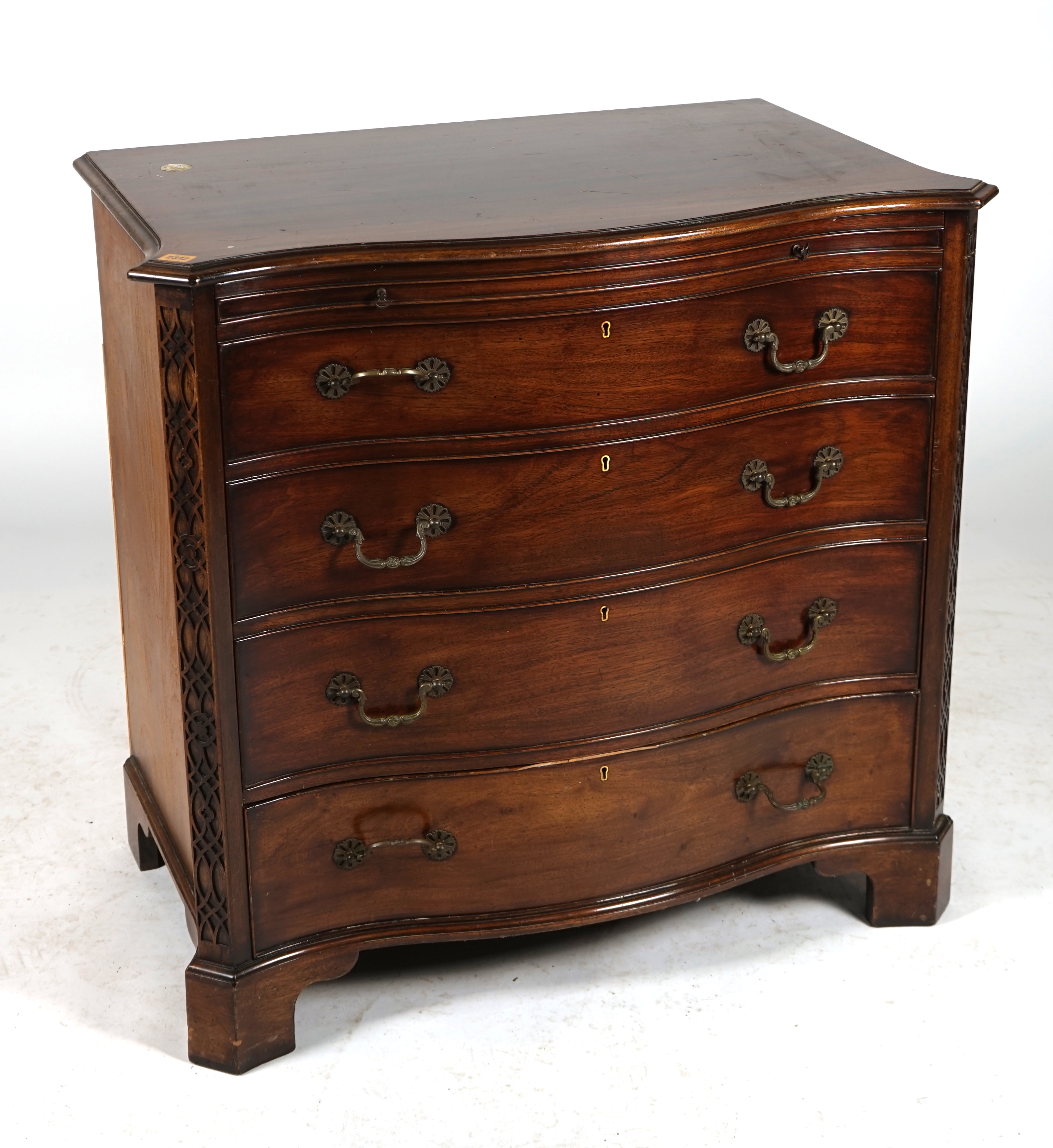 A GEORGE III STYLE MAHOGANY SERPENTINE T.V CHEST