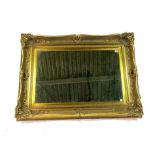 A VICTORIAN STYLE GOLD PAINTED RECTANGULAR WALL MIRROR