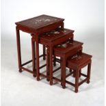 A MODERN CHINESE HARDWOOD AND MOTHER OF PEARL INLAID NEST OF FOUR TABLES (4)