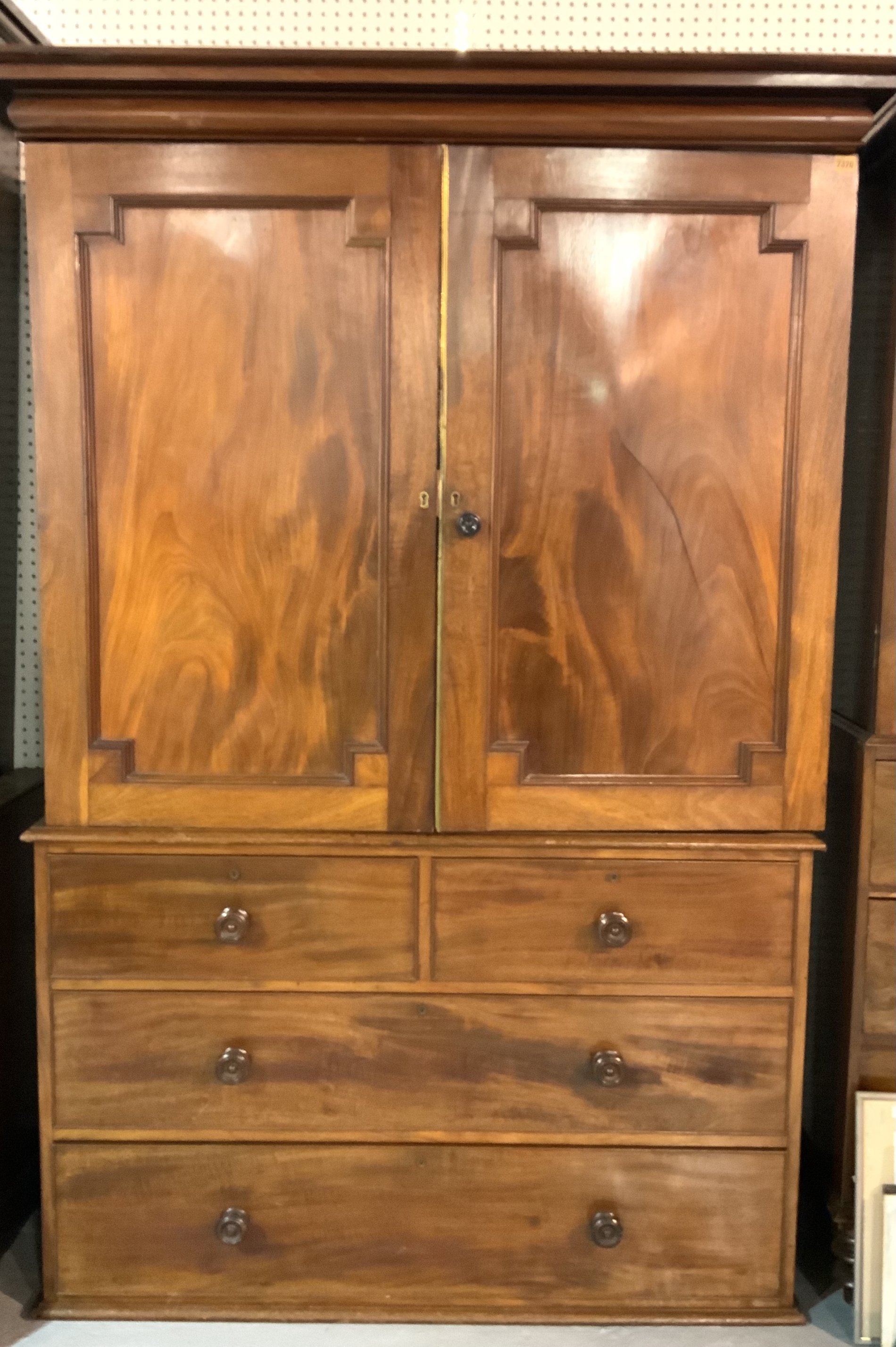 A 19TH CENTURY MAHOGANY LINEN PRESS